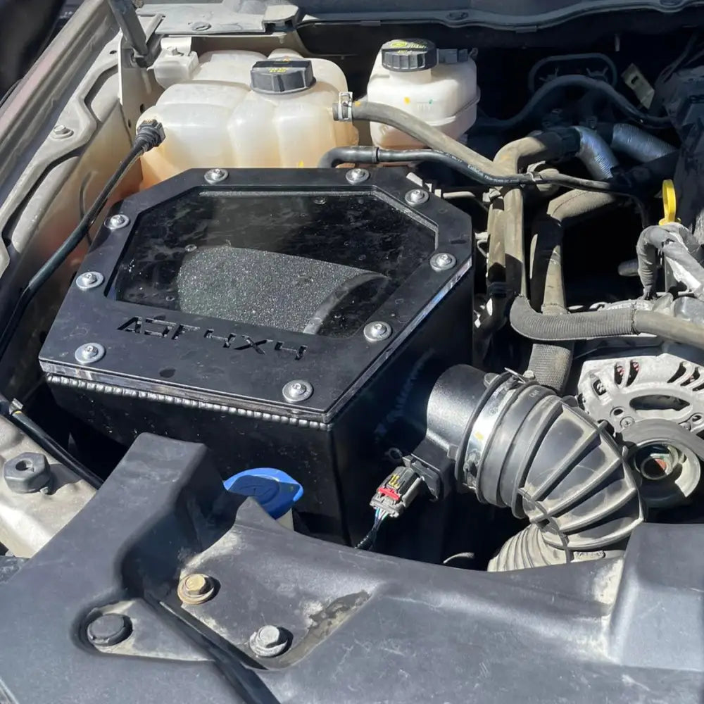 Close-up of a car engine with various components visible