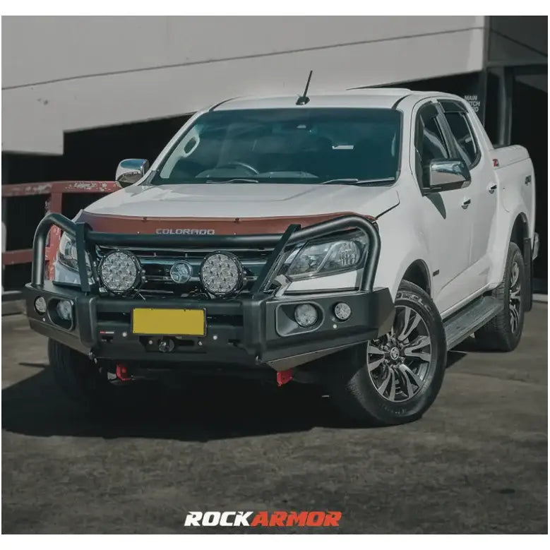 White Colorado pickup truck with elite steel bullbar and aftermarket bumper upgrade