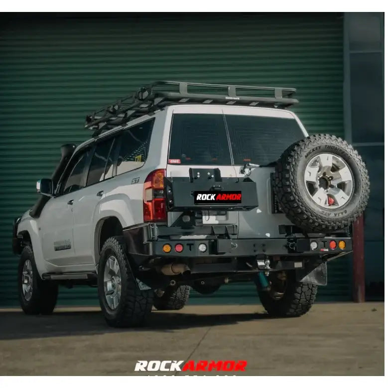 White SUV with Rockarmor Steel Dual Wheel Carrier for Nissan Patrol Y61 spare wheel