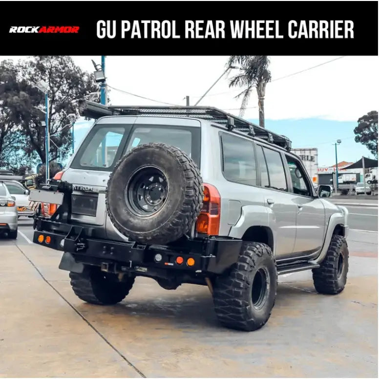 Silver SUV with rear wheel carrier for Nissan Patrol Y61 spare wheel fitting video