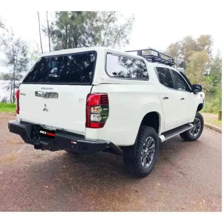 White Mitsubishi pickup truck with Rockamor Elite Steel Rear Step Towbar, rear step tow