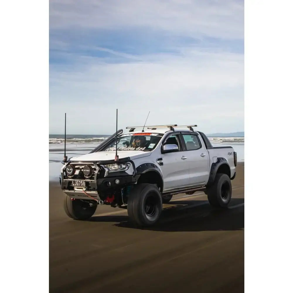 Modified white Ford Ranger PX2 pickup truck equipped with rockarmor gt steel hoop bullbar and synthetic winch rope combo pack