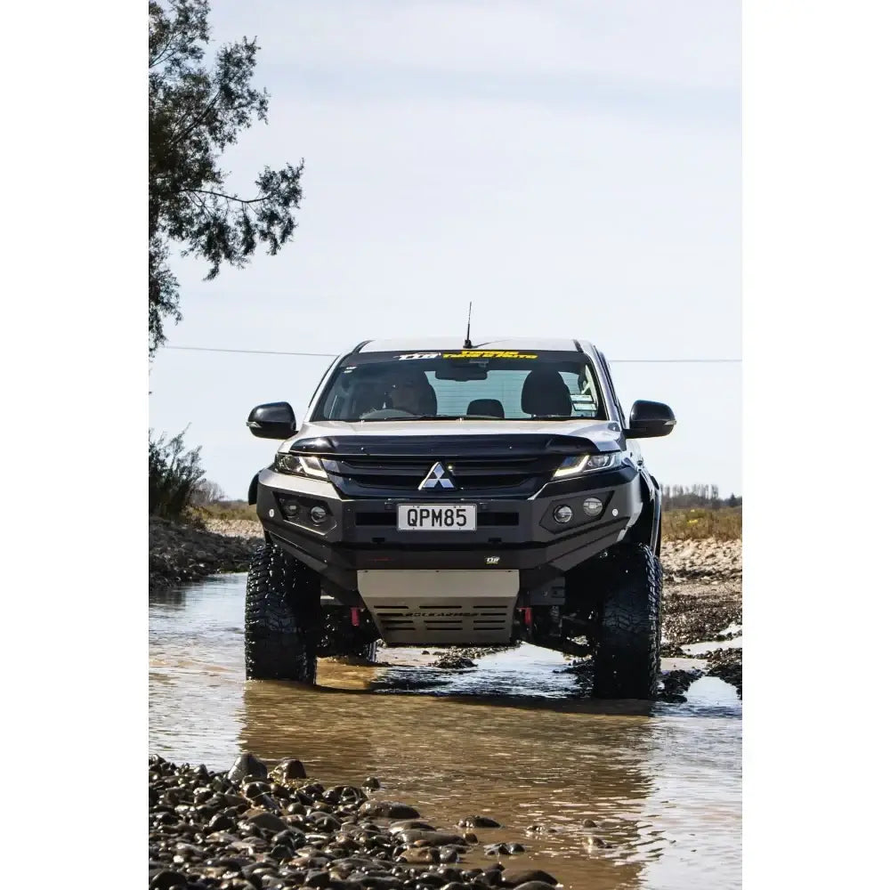 Black mitsubishi mr triton off-road truck equipped with rockarmor gt steel hoopless bullbar and synthetic winch rope combo pack