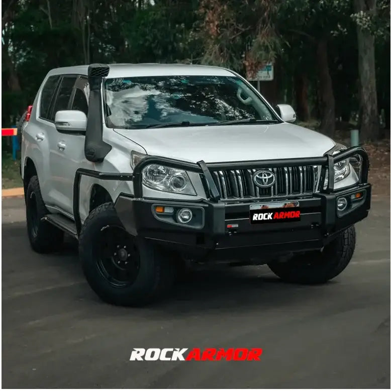 Silver off-road Toyota SUV with Rockarmor premium steel bullbar and fog lights