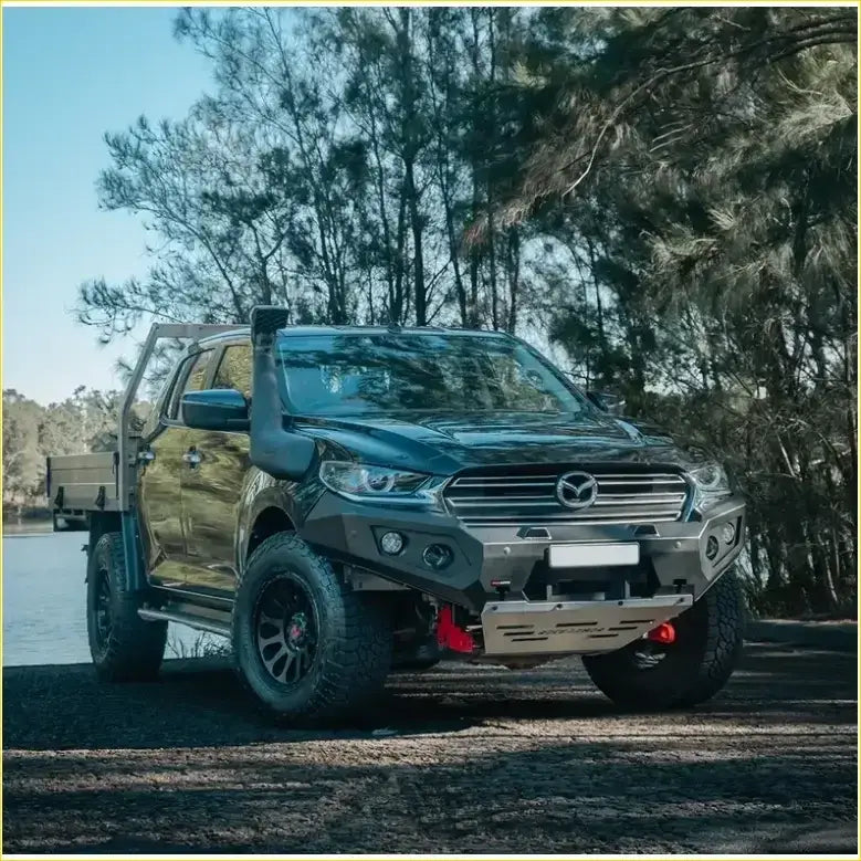 Black mazda bt50 2020+ with matte finish featuring gt hoopless bullbar and rock sliders off-road setup