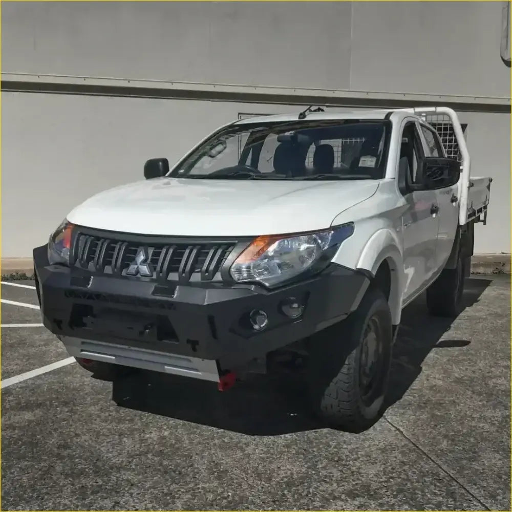 White mitsubishi triton with black gt hoopless bullbar and rock sliders from rockarmor rock pack set up