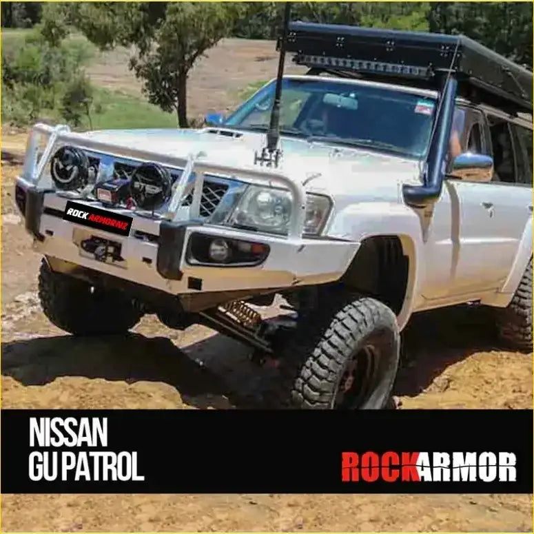 White nissan patrol gu4 suv with black rockarmor rock pack bullbar and rock sliders for offroad protection