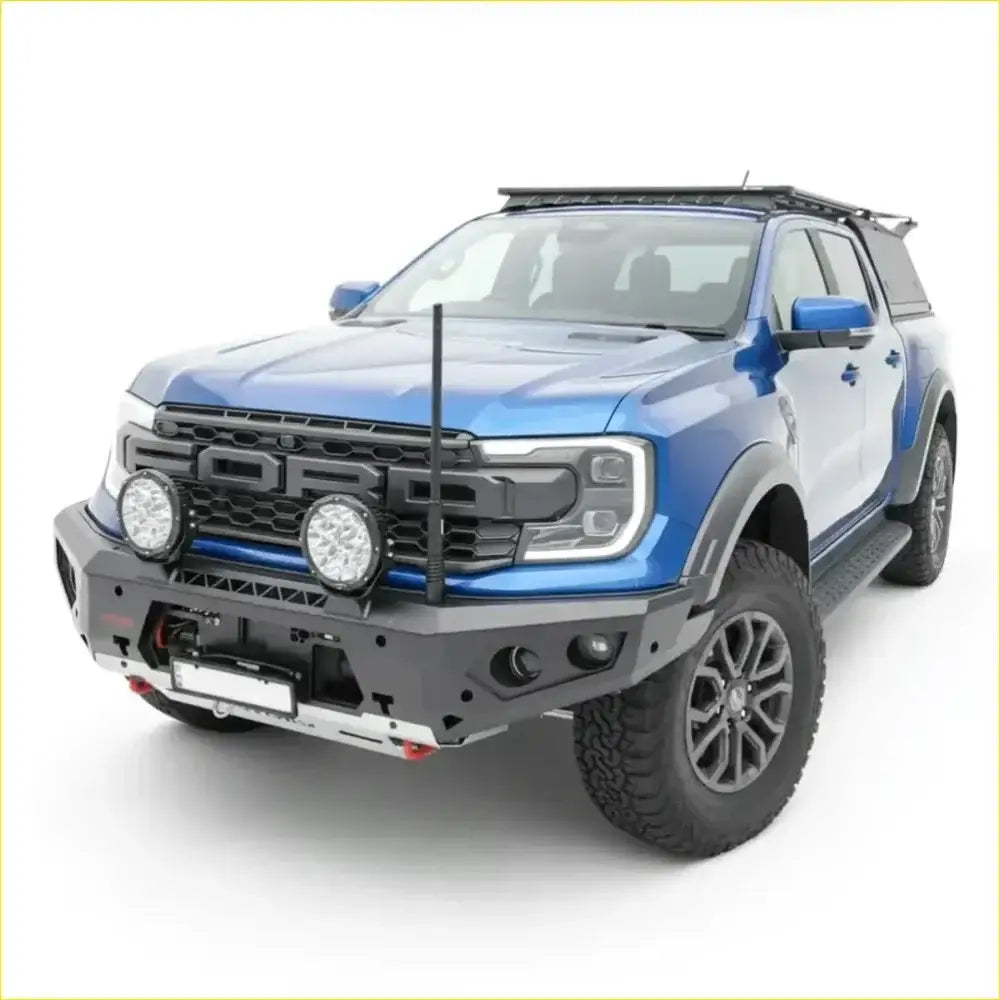 Blue ford ranger raptor with black front bumper and roof rack featuring rockarmor gt hoopless bullbar and rock sliders