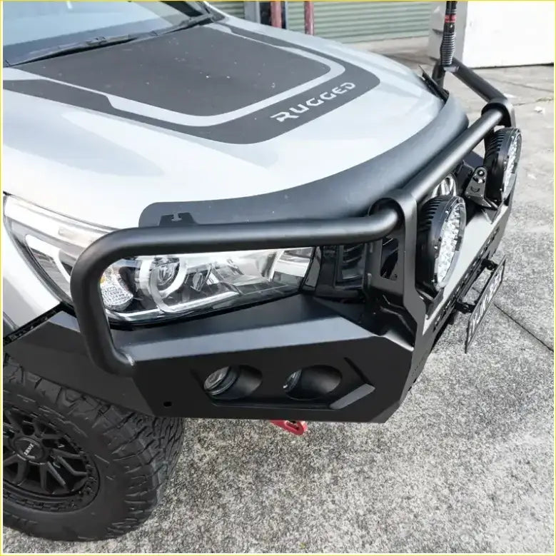 Black metal rockarmor rock pack bullbar with integrated circular lights and angular design for toyota hilux n80 2015-2020