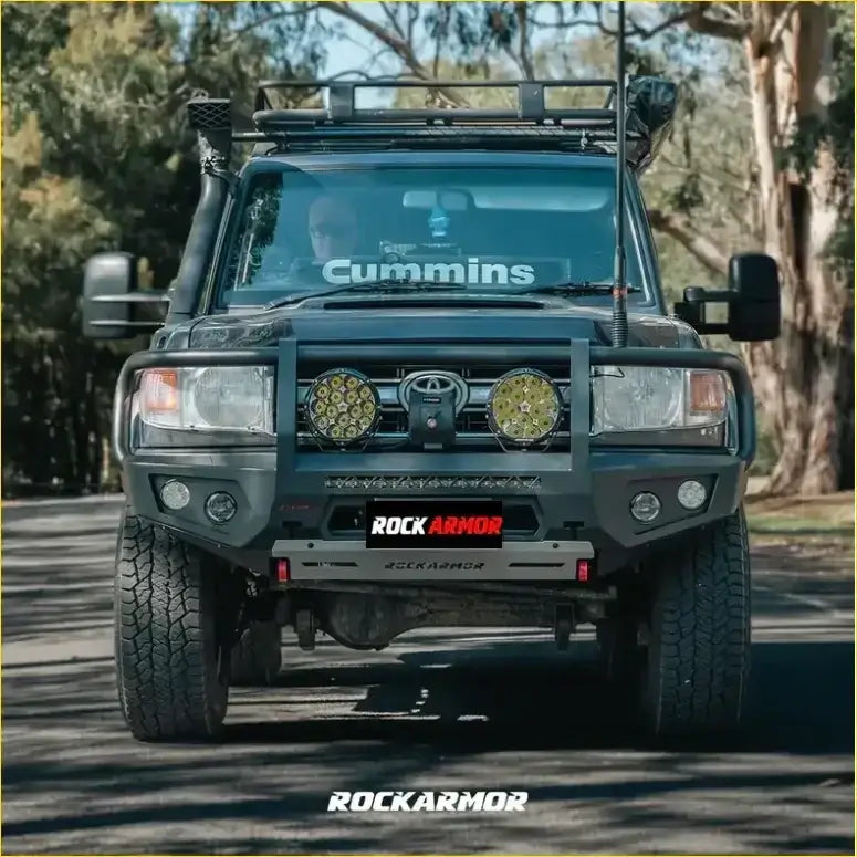 Black toyota land cruiser with rockarmor front bumper and dual circular led lights from rockarmor rock pack