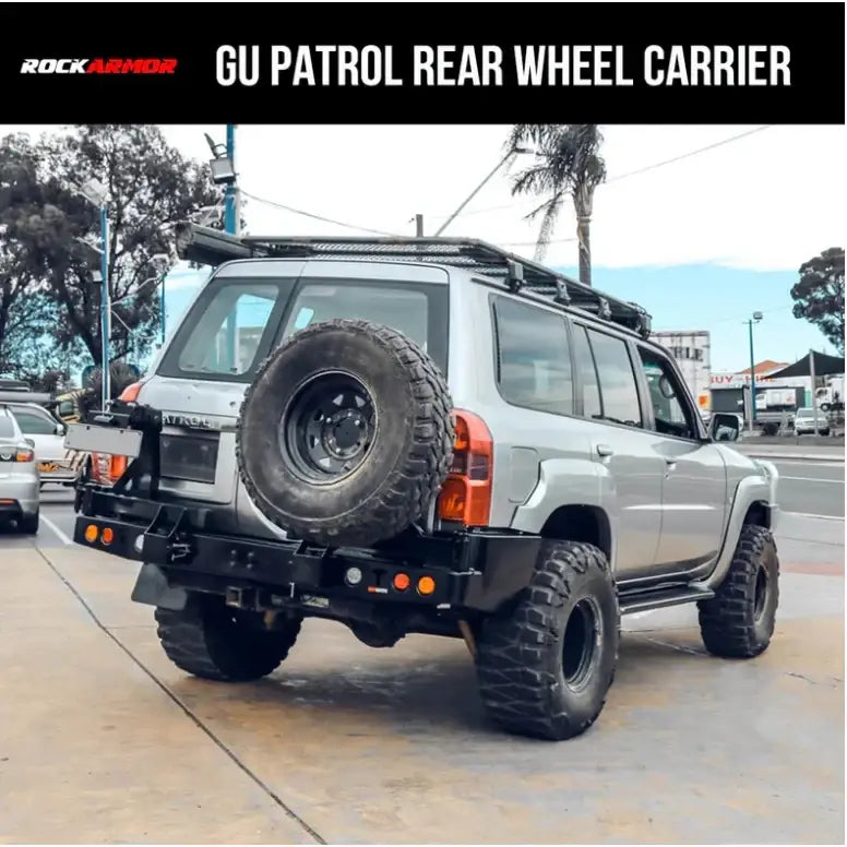 Rear view of silver nissan patrol y61 fitted with rockarmor steel dual wheel carrier for 2004 to 2016 models