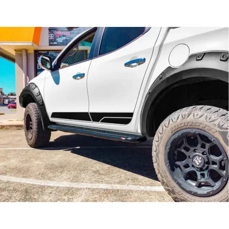 White pickup truck with black accents featuring rockarmor steel rockslider side steps for mitsubishi triton ml/mn dual cab