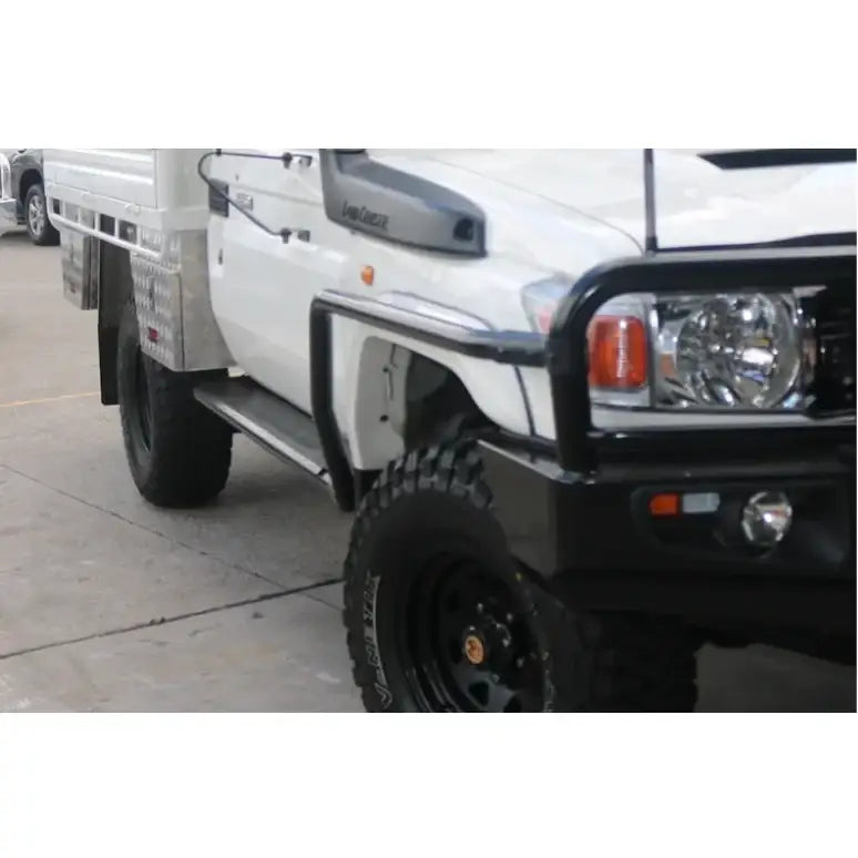 White utility truck featuring black bull bar and rockarmor steel rockslider side steps with steel checker plate for toyota landcruiser suit