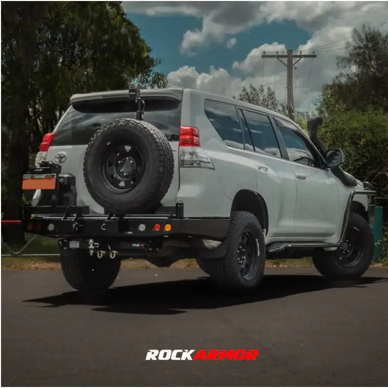 White SUV with rear spare wheel carrier on Gen III Dual Wheel Carrier for Toyota Landcruiser