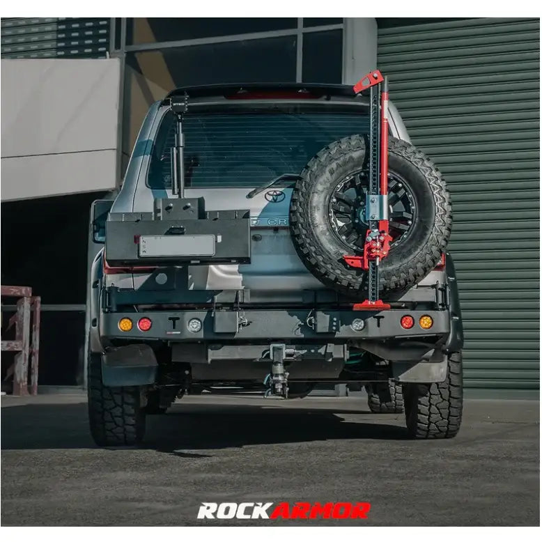 Silver SUV with rear-mounted spare wheel carrier and jack for Toyota Landcruiser Fj100 Gen III