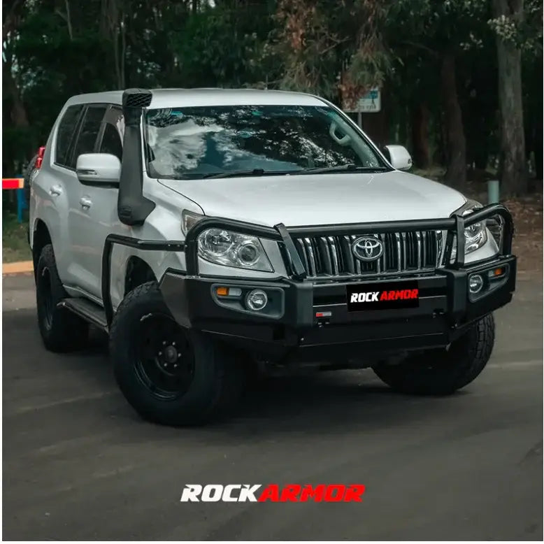 Silver off-road vehicle with black accessories featuring the Rockarmor Elite Steel Bullbar for Toyota Prado 150 2009-2013