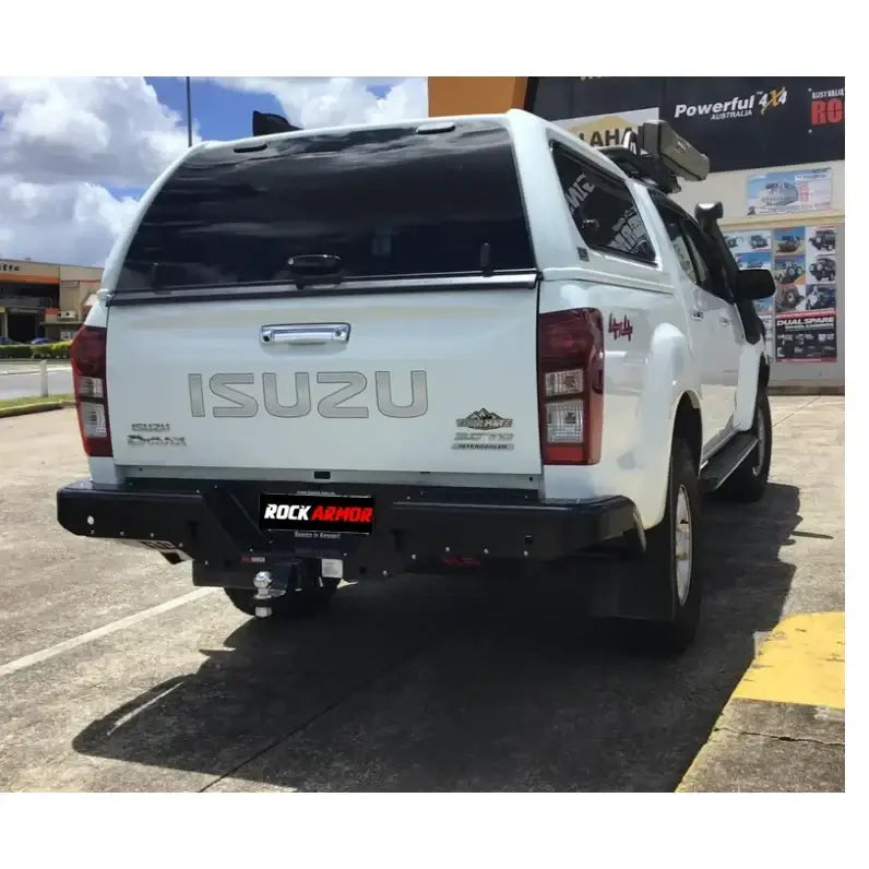 White Isuzu pickup truck showing rockamor elite steel rear step in white steel rear step design