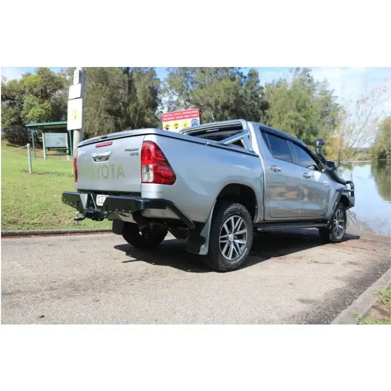 Silver Toyota Hilux N80 rear view fitted with Rockamor Elite Steel rear step towbar for added durability and towing capability