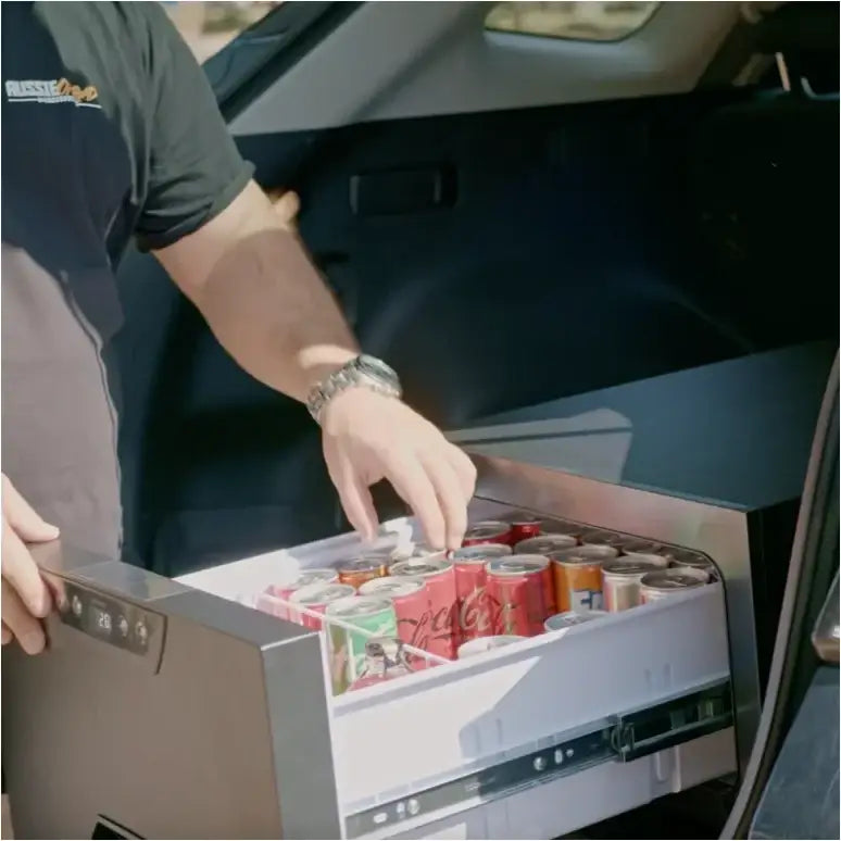 Rockarmor 31 litre vehicle draw fridge in black showing mounting brackets for outback traveller use in car trunk drawer