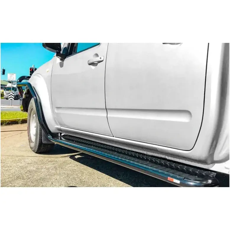 Silver pickup truck fitted with rockarmor rockslider brushbar in premium steel suit nissan navara d40 2005-2015