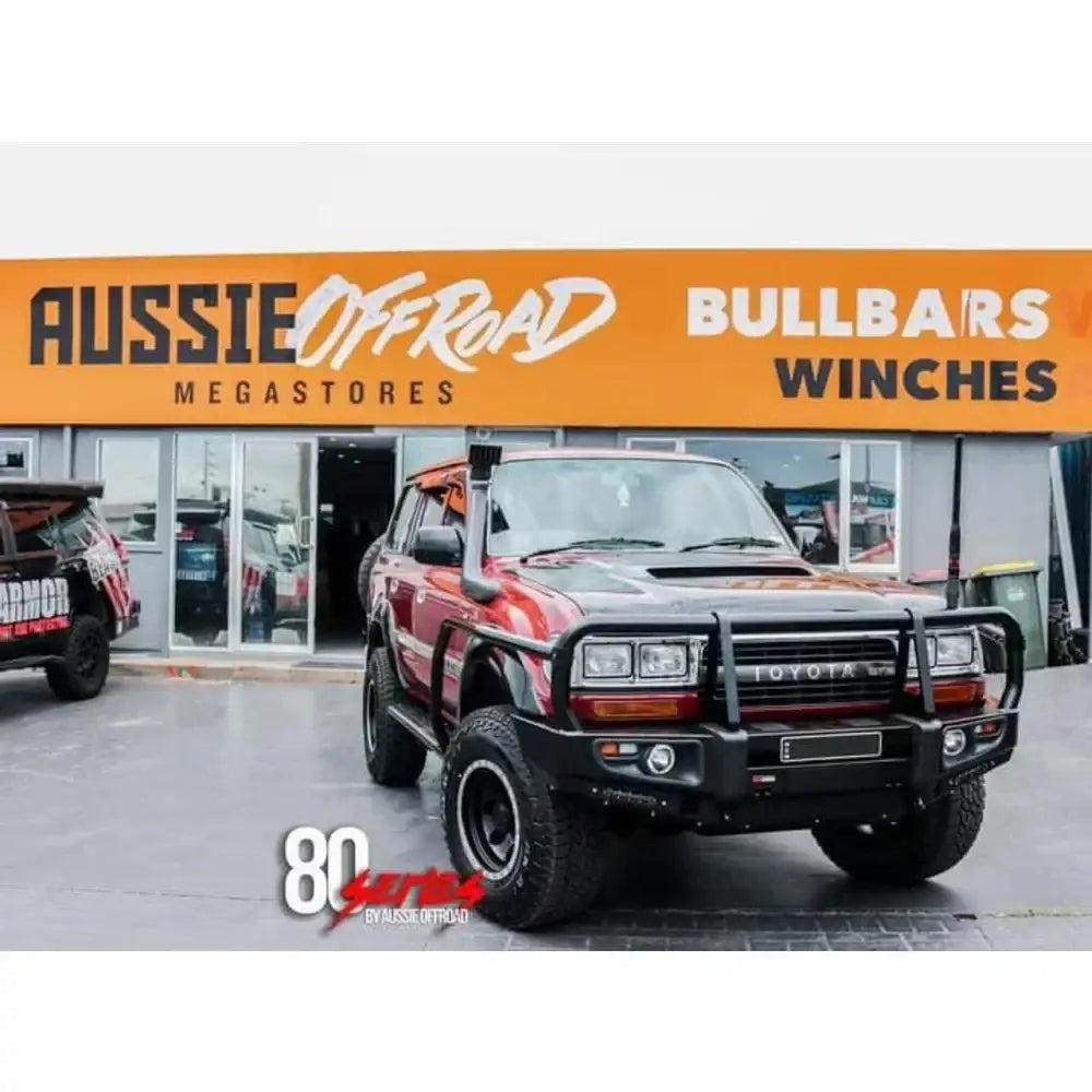 Red toyota landcruiser with rockarmor bull bar designed to suit toyota landcruiser models 100 105 80 120 200
