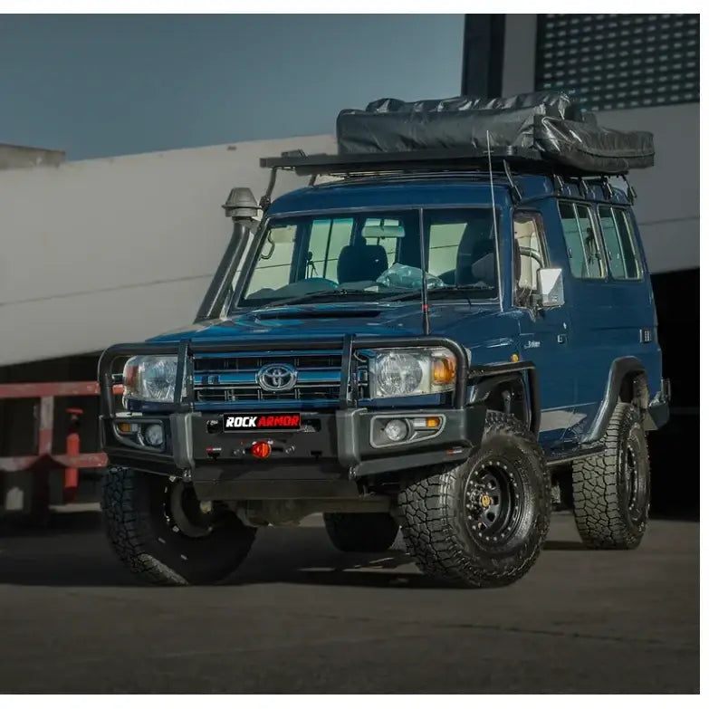 Blue off-road toyota troopy carrier with roof tent featuring rockarmor rockslider for rugged protection