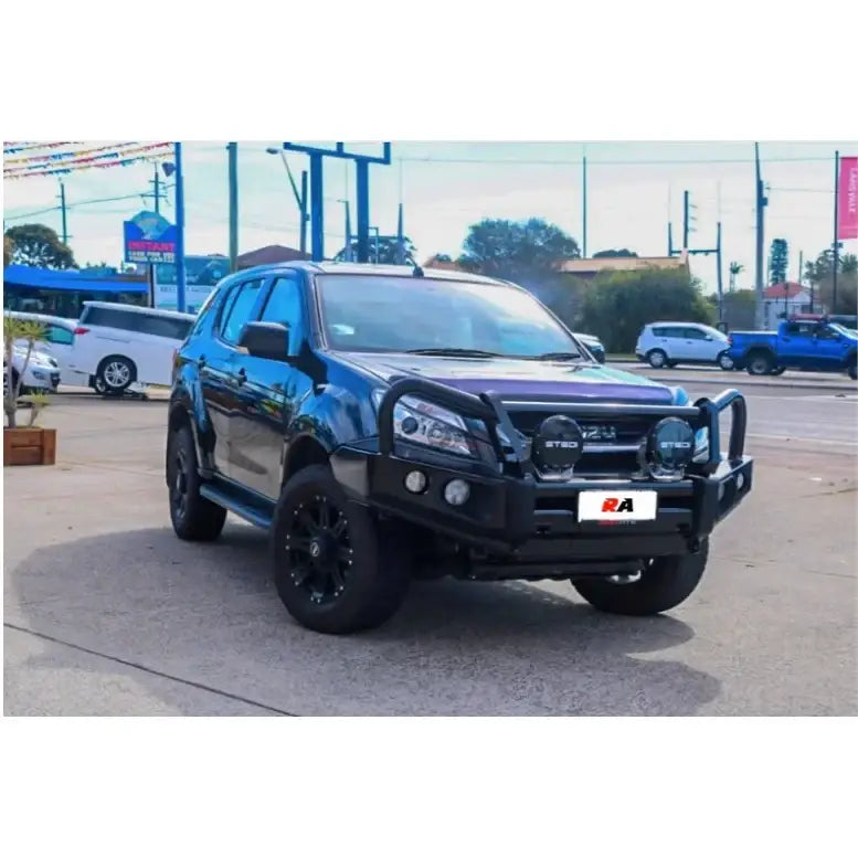 Dark blue isuzu mux with rockarmor elite hoop bull bar featuring black steel material and integrated fog lights