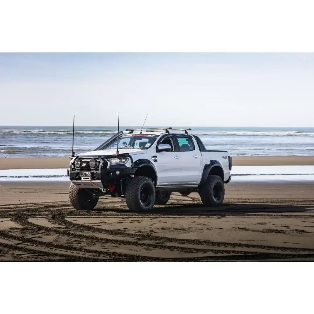 White modified Ford Ranger PX2 pickup truck featuring rockarmor gt steel hoop bullbar with synthetic winch rope combo pack