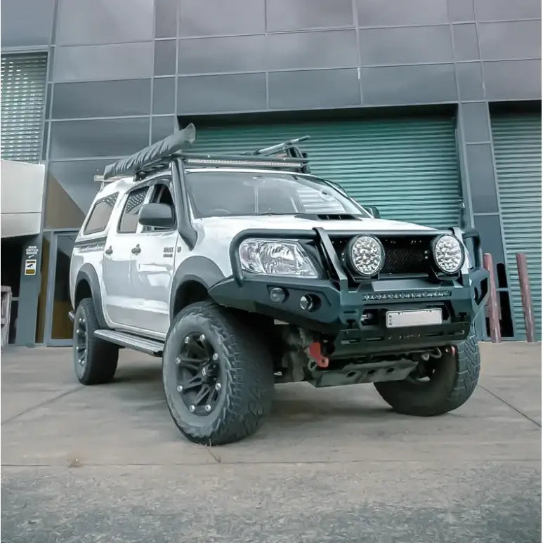 White off-road Toyota Hilux N70 featuring rockarmor gt steel hoop bullbar combo for enhanced front-end protection