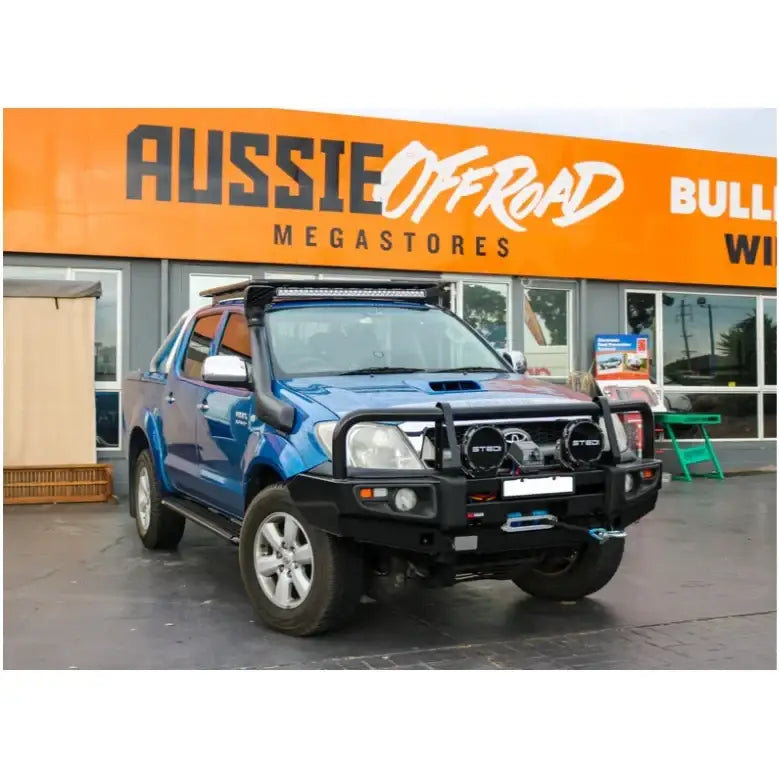 Blue off-road Toyota Hilux N70 with rockarmor premium steel bull bar featuring bumper cut design 2005 to 2011 model