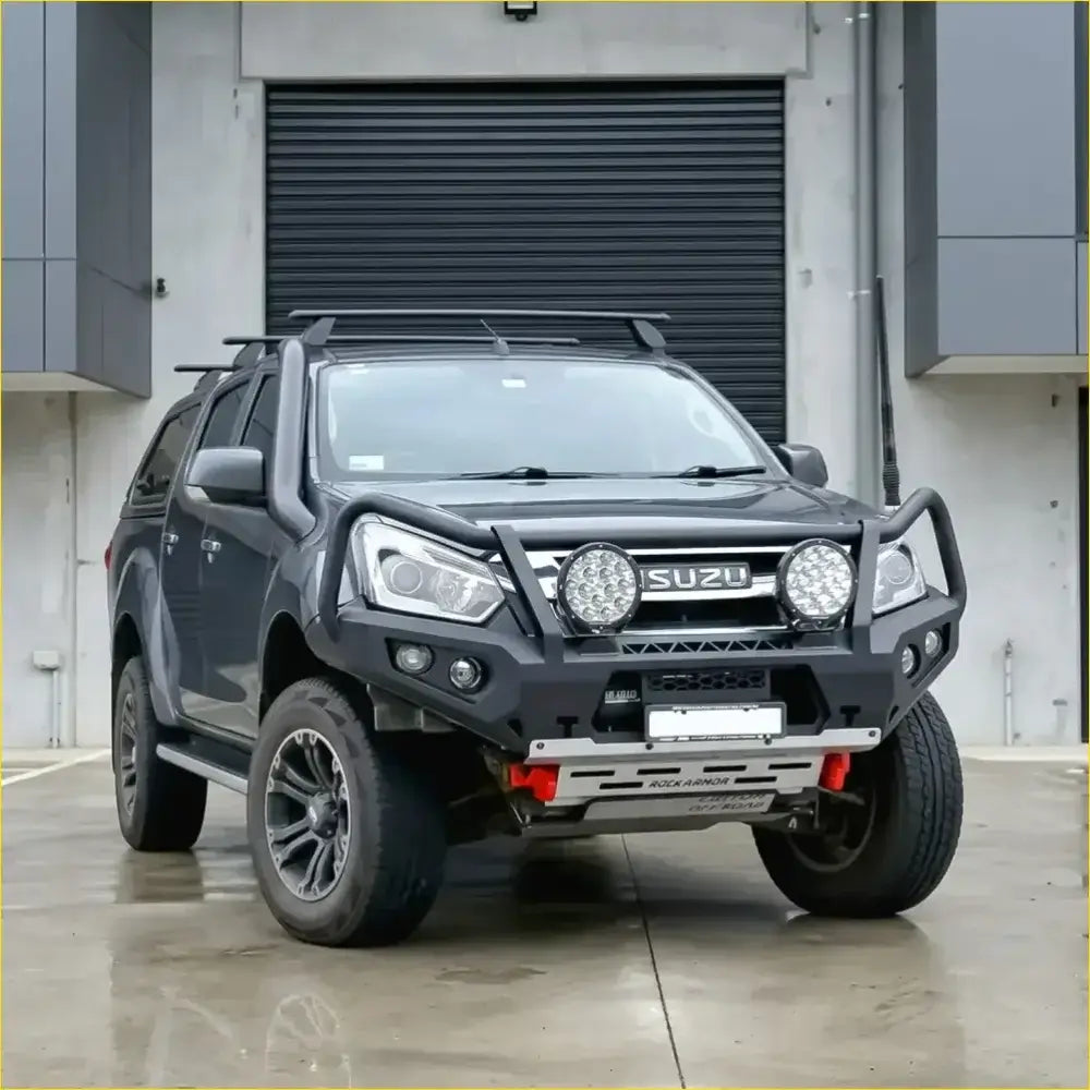 Black isuzu d-max 2017-2020 with rockarmor rock pack featuring gt hoop bullbar roof rack and rock sliders for off-road use