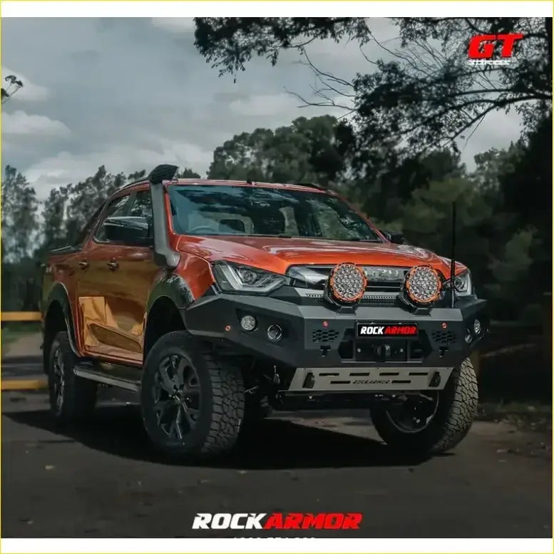 Orange isuzu dmax pickup with black rockarmor gt hoopless bullbar front bumper and round led lights