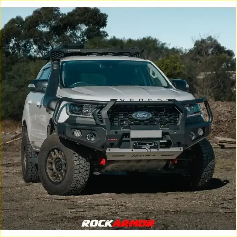 Silver ford everest pickup truck with black rockarmor front bumper and roof rack in rockarmor rock pack setup
