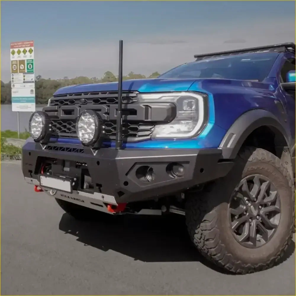 Blue ford ranger with black gt hoopless bullbar and rock sliders from rockarmor rock pack for ranger raptor 2023+