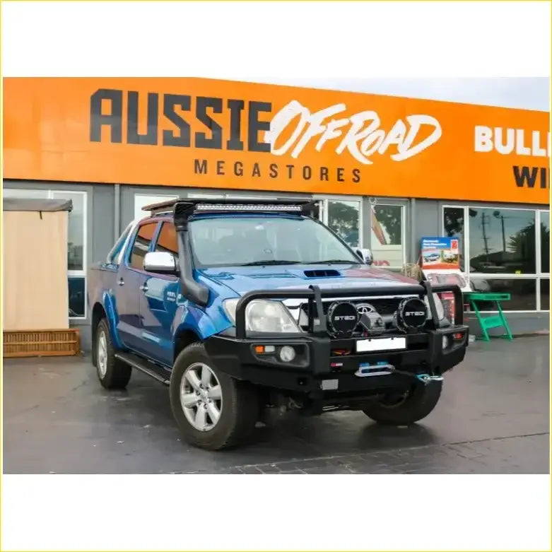 Blue toyota hilux n70 2005 2011 with black rockarmor premium bullbar roof light and off-road bumper