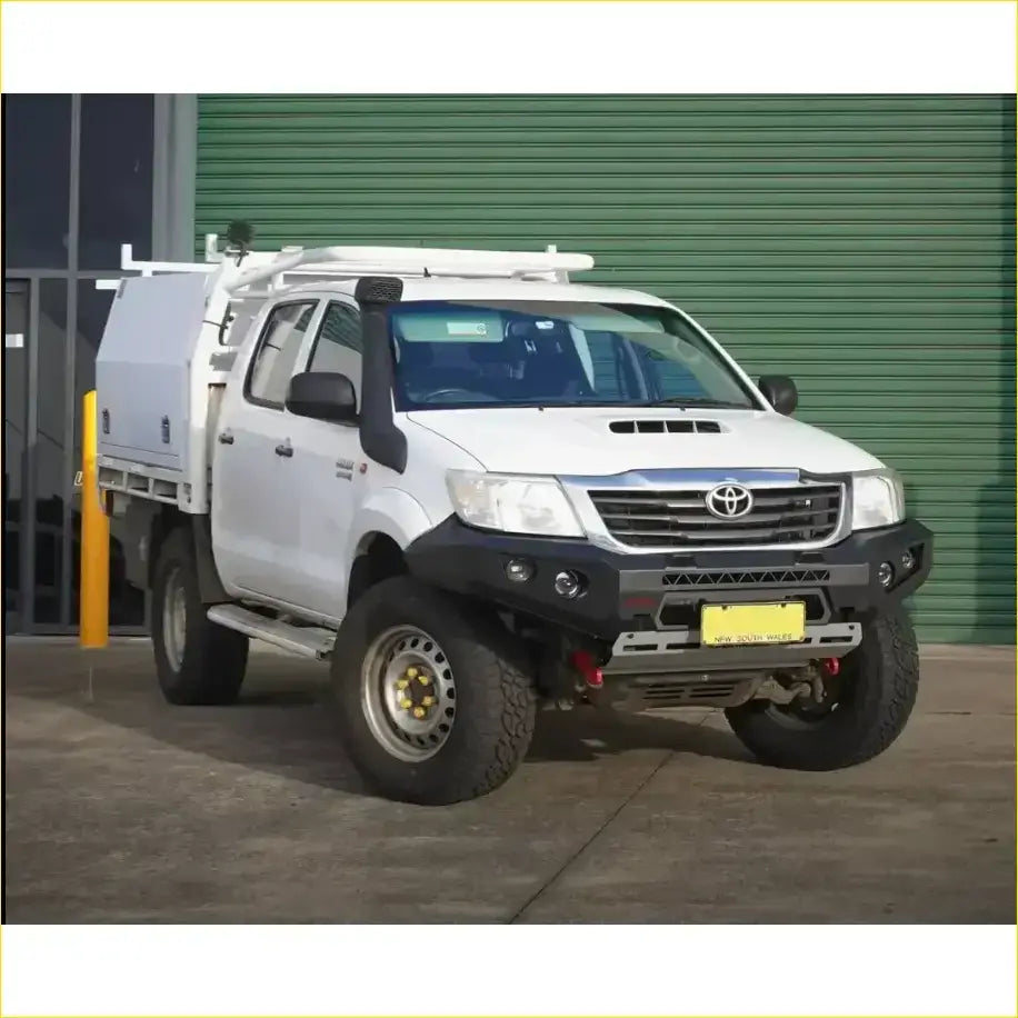 White toyota hilux n70 2011-2015 with black gt hoopless bullbar roof rack and rock sliders side steps from rockarmor rock pack
