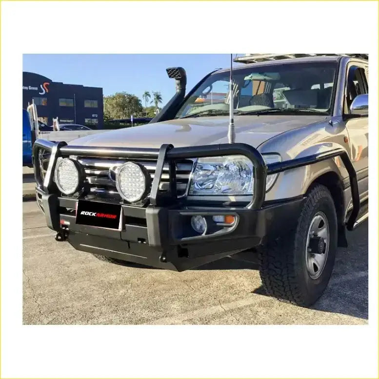 Black rockarmor front bumper for toyota landcruiser fj100 with integrated circular led lights and rugged protective design