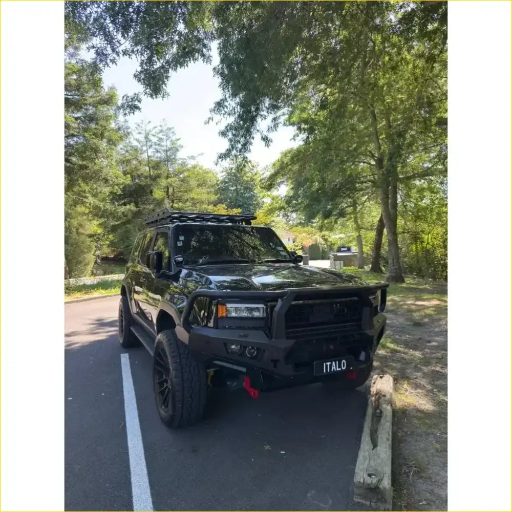 Black rugged toyota prado 250 suv with gt hoop bullbar roof rack and rock sliders from rockarmor rock pack
