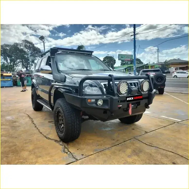 Black toyota prado fj120 with rockarmor rock pack premium bullbar roof rack and large round headlights