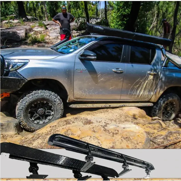Silver off-road pickup truck featuring rockarmor steel rockslider checker plate step for toyota hilux n80 rear side view