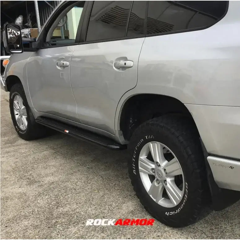Silver toyota landcruiser 200 with rockarmor steel rockslider side steps featuring steel checker plate step